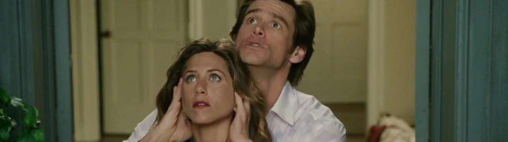 escena de la pelicula como dios con Jim Carrey y Jennifer aniston